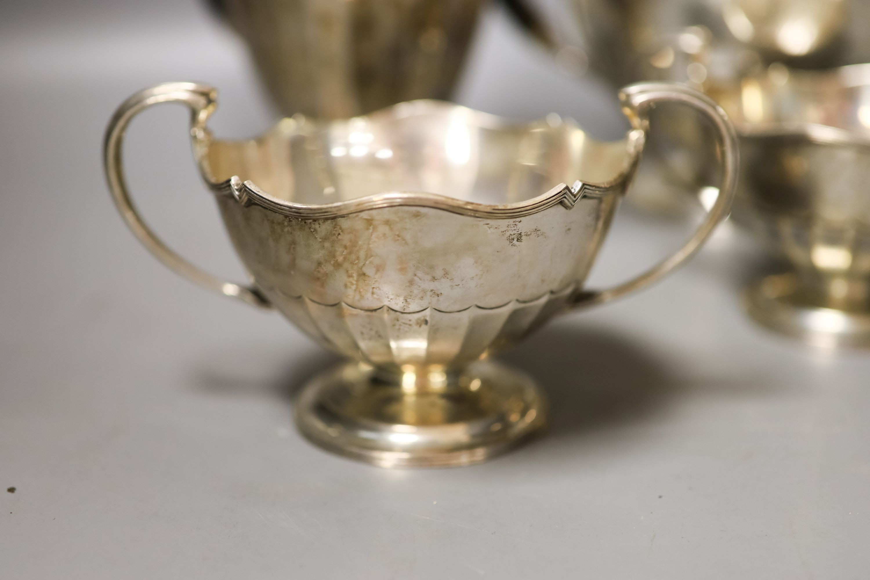 A George V four piece silver circular tea set, Fenton, Russel & Co Ltd, Birmingham, 1912